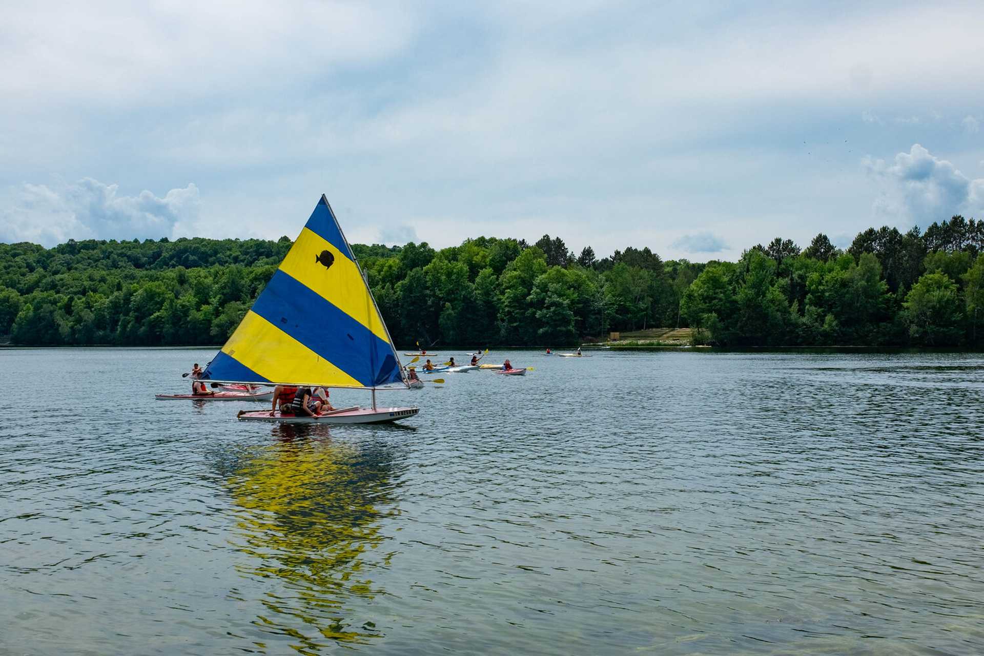 A sail boat on the water at Camp MaKaJaWan